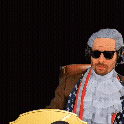A Man Wearing A Wig And Sunglasses Stands Next To A Man Wearing A 99 Rw Jersey GIF