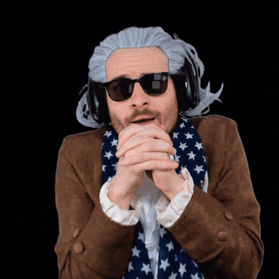 A Man Wearing A Wig And Sunglasses With The Letter N On His Face GIF
