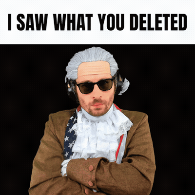 A Man Wearing A Wig And Sunglasses With The Words " I Saw What You Deleted " Above Him GIF