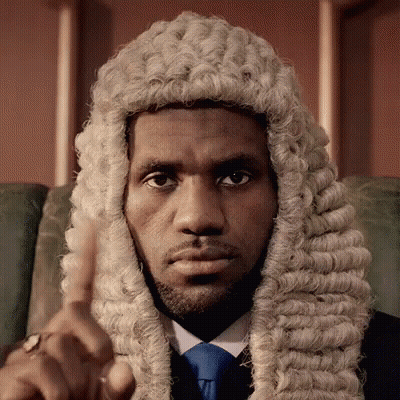 A Man Wearing A Wig And Tie Is Pointing GIF