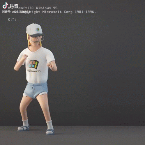 A Man Wearing A Windows 95 Shirt Stands In Front Of A Computer Screen GIF
