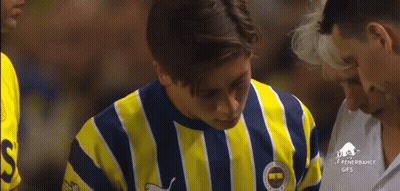 A Man Wearing A Yellow And Blue Striped Shirt With The Word Fenerbahce On The Front GIF