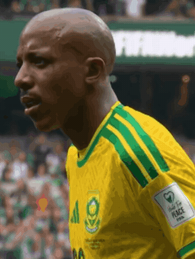 A Man Wearing A Yellow And Green Jersey With The Number 20 On It GIF