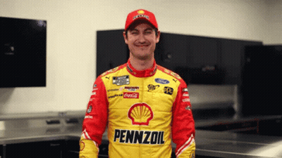 A Man Wearing A Yellow And Red Pennzoil Jacket GIF