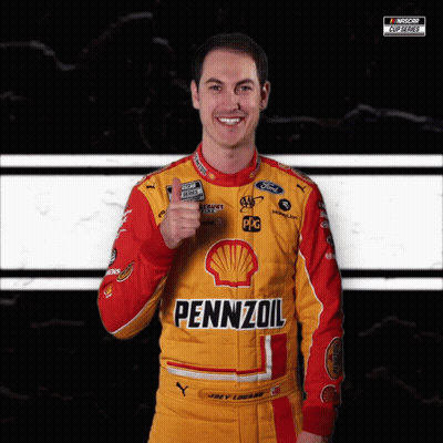 A Man Wearing A Yellow And Red Pennzoil Racing Suit Giving A Thumbs Up GIF