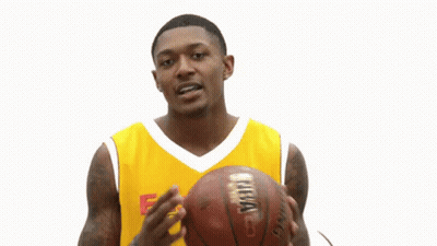 A Man Wearing A Yellow Easterns Automotive Group Jersey Holds A Basketball GIF