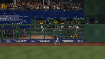 A Man Wearing A Yellow Gh Jersey Stands In The Dugout GIF