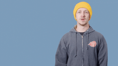 A Man Wearing A Yellow Hat And A Gray Hoodie Says " Don 'T Be A " GIF