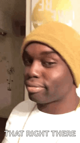 A Man Wearing A Yellow Hat And A White Shirt Is Making A Funny Face And Saying `` That Right There '' . GIF