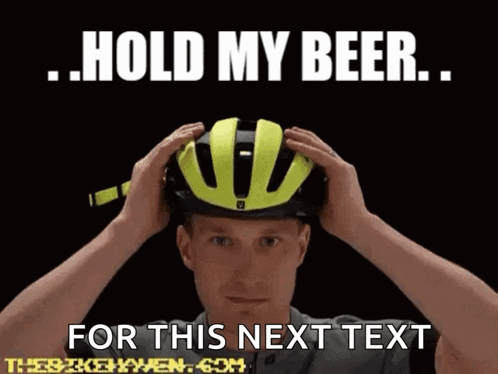 A Man Wearing A Yellow Helmet With The Words Hold My Beer For This Next Text GIF