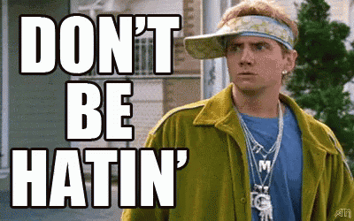 A Man Wearing A Yellow Jacket And A Visor Says " Don 'T Be Hatin " GIF