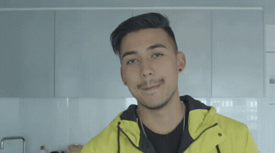 A Man Wearing A Yellow Jacket With Melbourne Written On The Bottom GIF