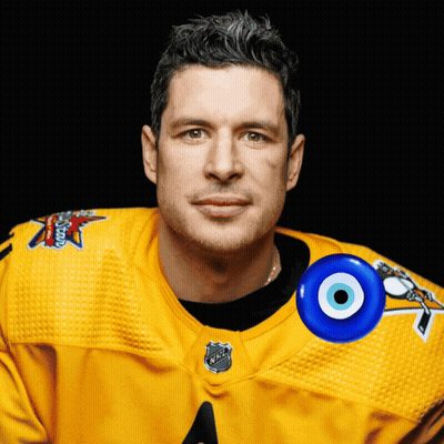 A Man Wearing A Yellow Jersey With The Letters Nhl On The Neck GIF