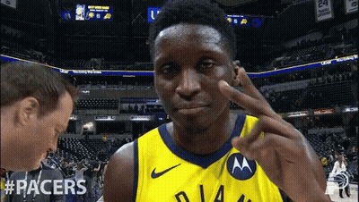 A Man Wearing A Yellow Jersey With The Word Racers On The Front GIF