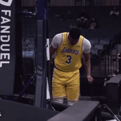 A Man Wearing A Yellow Lakers Jersey With The Number 3 GIF