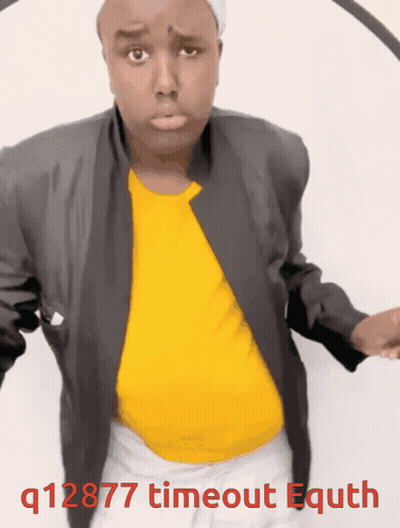 A Man Wearing A Yellow Shirt And A Black Jacket With The Words Q12877 Timeout Equth Written Below Him GIF