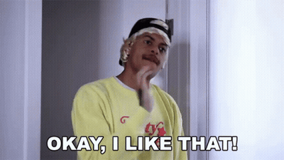 A Man Wearing A Yellow Shirt And A Headband Says Okay , I Like That ! GIF