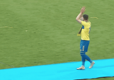 A Man Wearing A Yellow Shirt With The Number 11 On It Is Clapping GIF