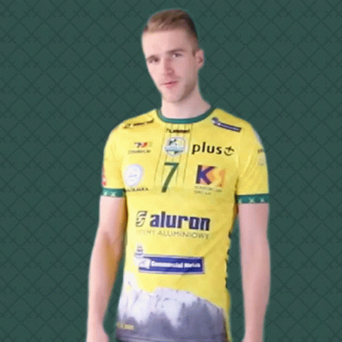A Man Wearing A Yellow Shirt With The Number 7 On The Front GIF