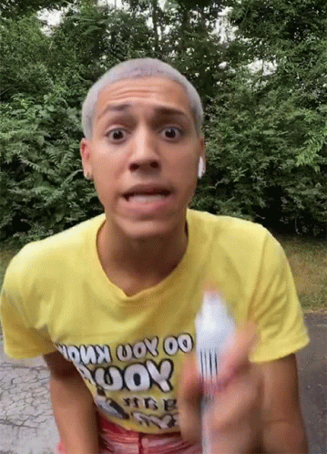 A Man Wearing A Yellow T-Shirt That Says " Do You Know " On It GIF