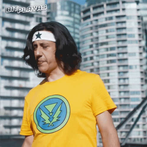 A Man Wearing A Yellow T-Shirt With A Lightning Bolt On It GIF