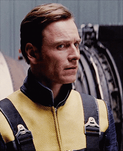 A Man Wearing A Yellow Vest With A Black Collar And Straps GIF
