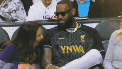 A Man Wearing A Ynwa Jersey Talks To A Woman In The Stands GIF
