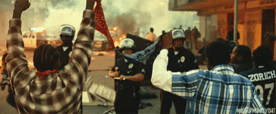 A Man Wearing A Zurich Jersey Is Standing In Front Of A Crowd Of People GIF