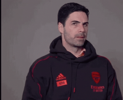 A Man Wearing An Adidas Hoodie With Emirates Fly Better Written On The Front GIF