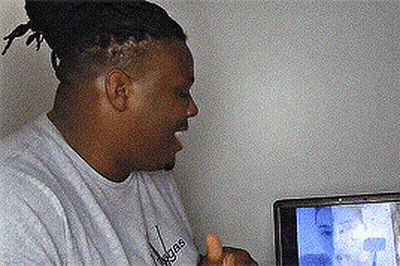 A Man Wearing An Adidas Shirt Is Giving A Thumbs Up In Front Of A Television GIF