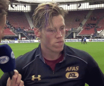 A Man Wearing An Afas Shirt Is Being Interviewed By A Reporter GIF