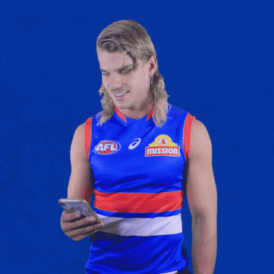 A Man Wearing An Afl Jersey Looks At A Cell Phone GIF