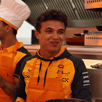 A Man Wearing An Apron And A Hoodie That Says ' Ferrari ' On It GIF