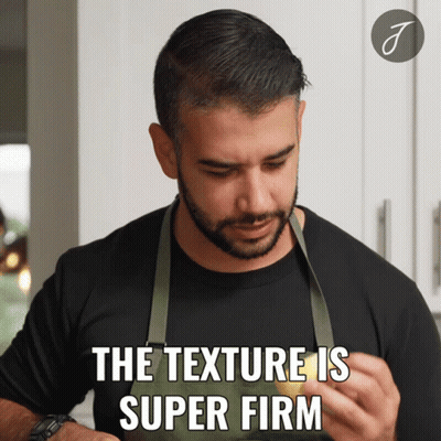 A Man Wearing An Apron Is Holding A Lemon And Says The Texture Is Super Firm GIF