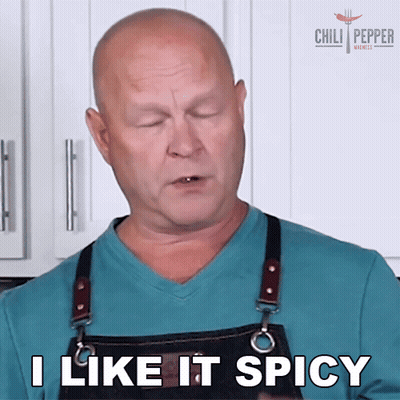 A Man Wearing An Apron Is Saying I Like It Spicy GIF
