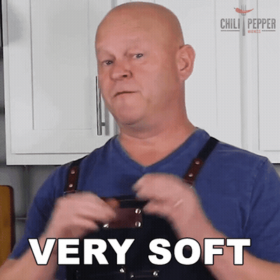 A Man Wearing An Apron Says Very Soft GIF