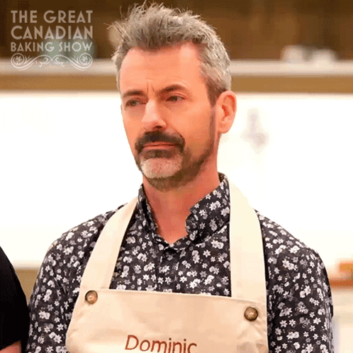 Man Wearing Apron On Great Canadian Baking Show GIF