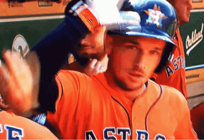 A Man Wearing An Astros Jersey Waves To Someone GIF