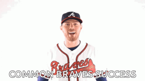 A Man Wearing An Atlanta Braves Jersey Is Celebrating GIF