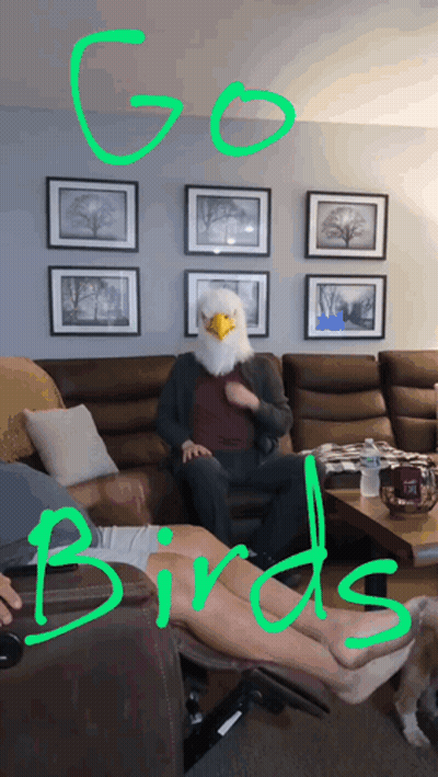 A Man Wearing An Eagle Mask Sits On A Couch With The Words Go Birds Above Him GIF