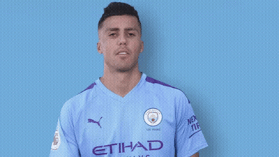 A Man Wearing An Etihad Airways Jersey Smiles For The Camera GIF