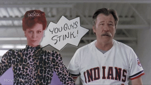 A Man Wearing An Indians Jersey Stands Next To A Woman GIF