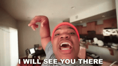 A Man Wearing An Orange Beanie Says I Will See You There GIF