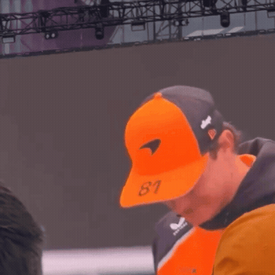 a man wearing an orange hat that says 81 on it