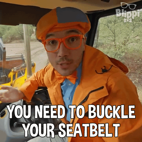 A Man Wearing An Orange Jacket And Glasses Says You Need To Buckle Your Seat Belt GIF