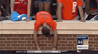 A Man Wearing An Orange Shirt That Says Crew On It GIF