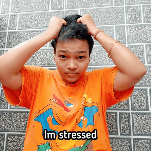 A Man Wearing An Orange Shirt That Says Im Stressed On It GIF