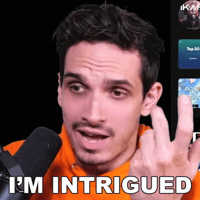 A Man Wearing An Orange Sweatshirt Says I 'M Intrigued GIF