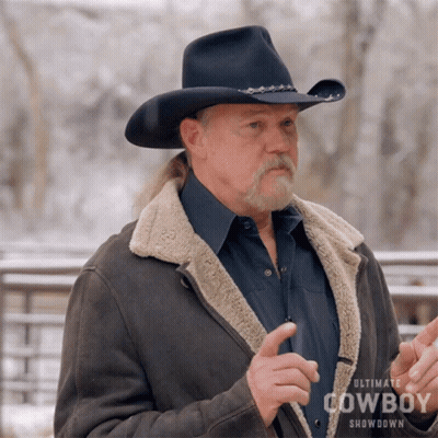 A Man Wearing An Ultimate Cowboy Showdown Jacket And Hat GIF