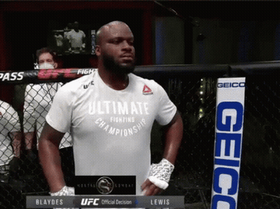 A Man Wearing An Ultimate Fighting Championship Shirt Stands In A Cage GIF